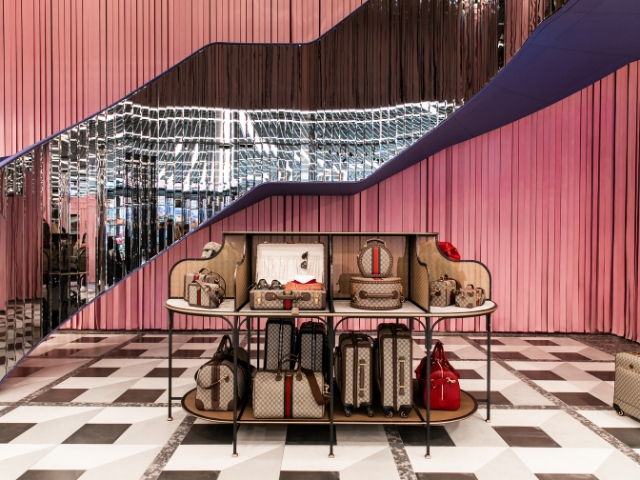 Store display of Gucci luggage