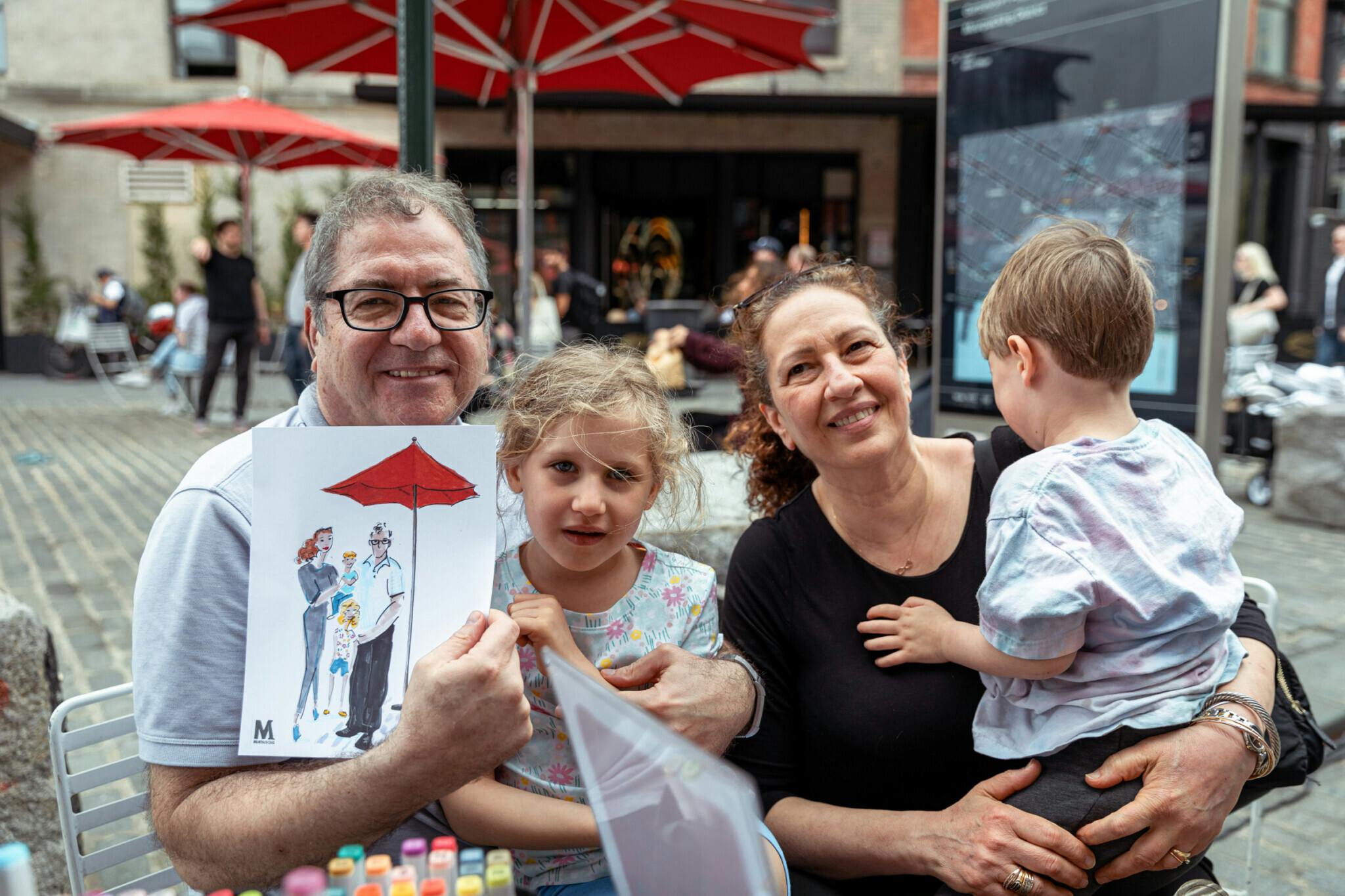 Family with hand-sketched portrait in the Meatpacking District
