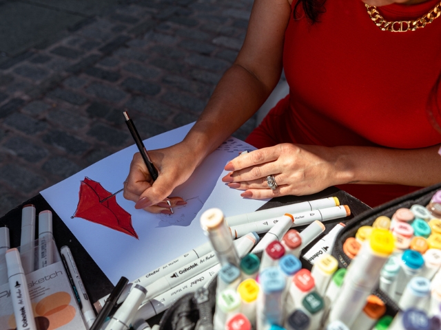 Laura Baran sketching a portrait in the Meatpacking District. 